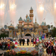 Fireworks explode under cloudy skies as Disney dignitaries and characters appear in front of Sleeping Beauty Castle at the close of ceremonies for the 50th anniversary of Disneyland May 5, 2005 in Anaheim, California.